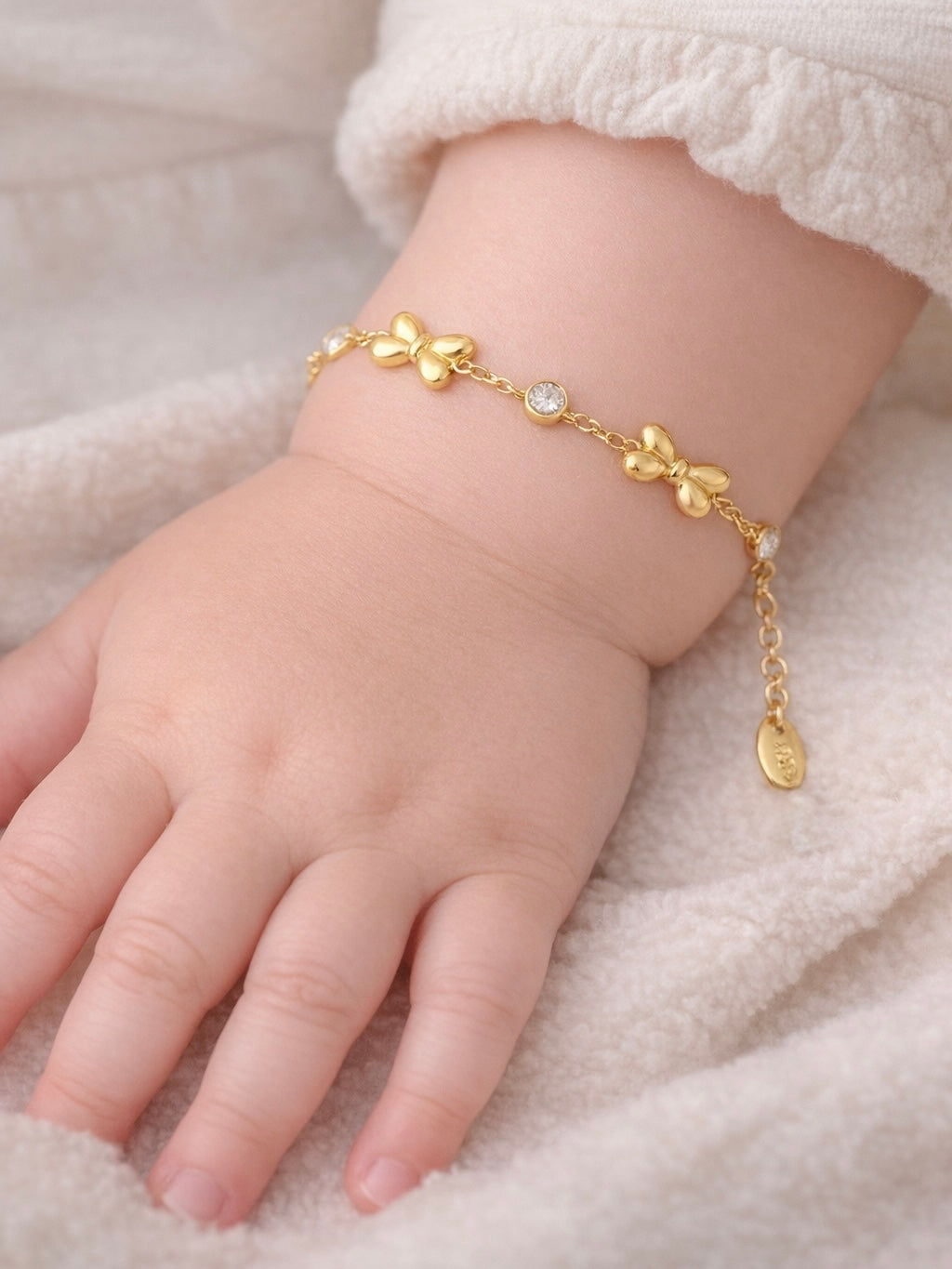 armbandje kind  gouden strik